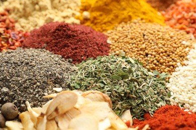 Photo of Different aromatic spices as background, closeup view