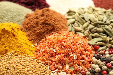 Photo of Different aromatic spices as background, closeup view