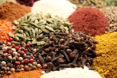 Photo of Different aromatic spices as background, closeup view