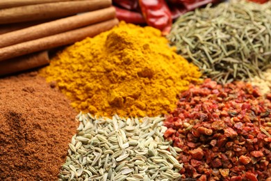 Photo of Different aromatic spices as background, closeup view