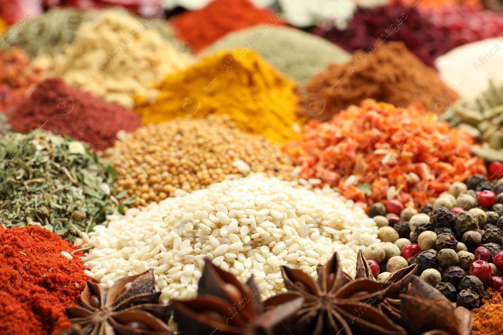 Different aromatic spices as background, closeup view Photo of Different aromatic spices as background, closeup view