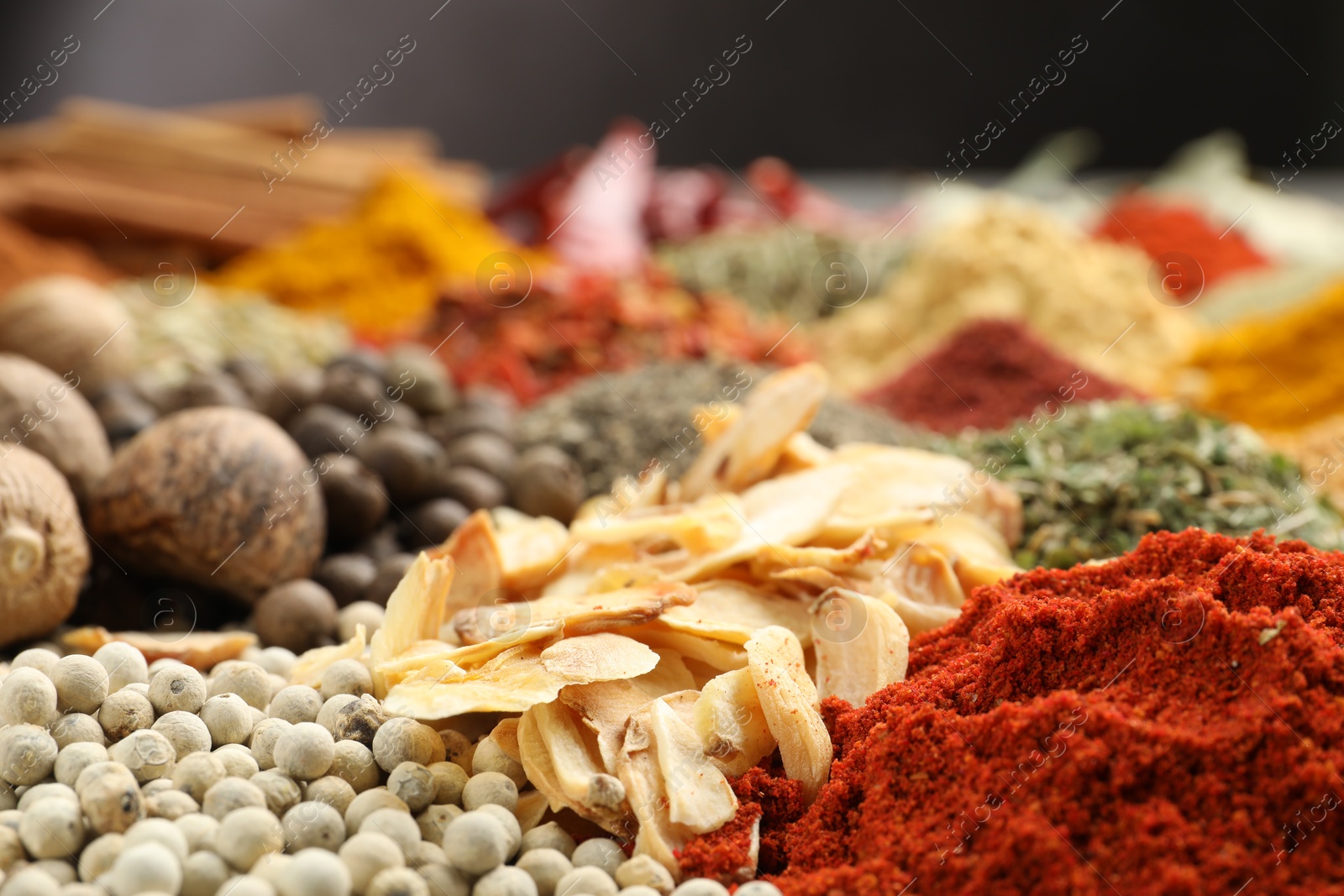 Different aromatic spices on table, closeup view Photo of Different aromatic spices on table, closeup view