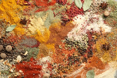 Photo of Different aromatic spices on grey table, top view