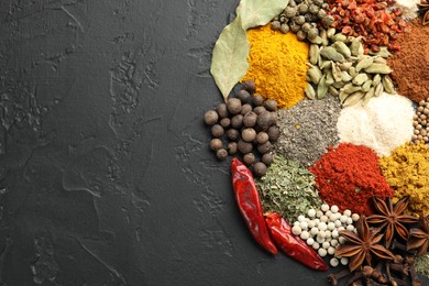 Photo of Different aromatic spices on grey table, top view. Space for text