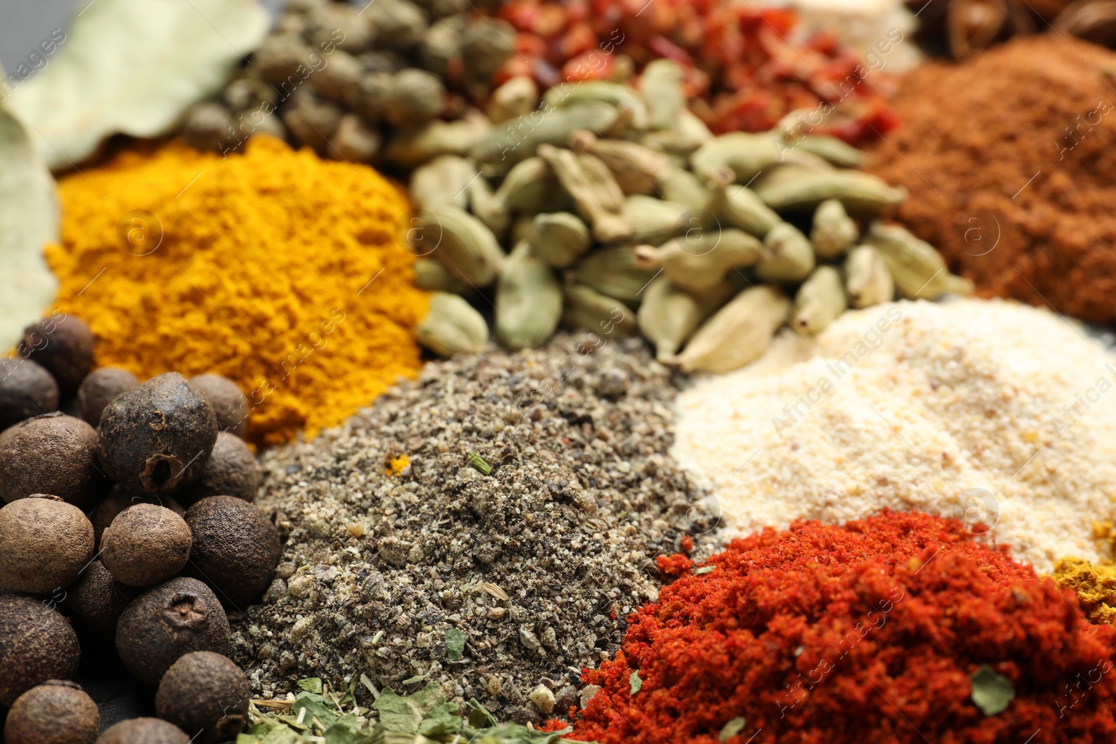 Different aromatic spices as background, closeup view Photo of Different aromatic spices as background, closeup view
