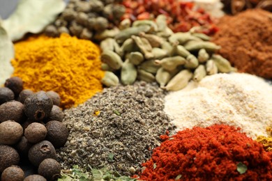 Photo of Different aromatic spices as background, closeup view