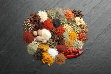Photo of Different aromatic spices on grey table, top view