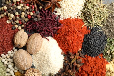 Photo of Different aromatic spices as background, top view
