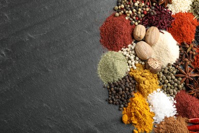 Photo of Different aromatic spices on grey table, top view. Space for text