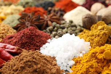 Photo of Different aromatic spices as background, closeup view