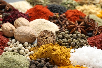 Photo of Different aromatic spices as background, closeup view