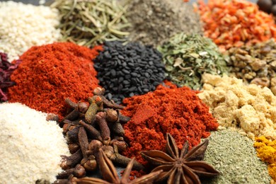 Photo of Different aromatic spices as background, closeup view