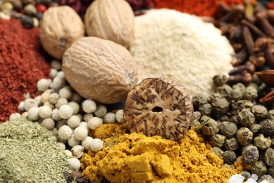 Photo of Different aromatic spices as background, closeup view