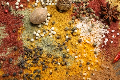 Photo of Different aromatic spices as background, top view