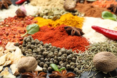 Photo of Different aromatic spices as background, closeup view