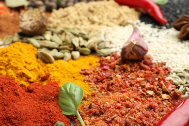 Photo of Different aromatic spices as background, closeup view