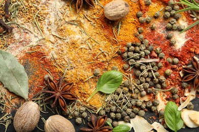 Photo of Different aromatic spices as background, top view