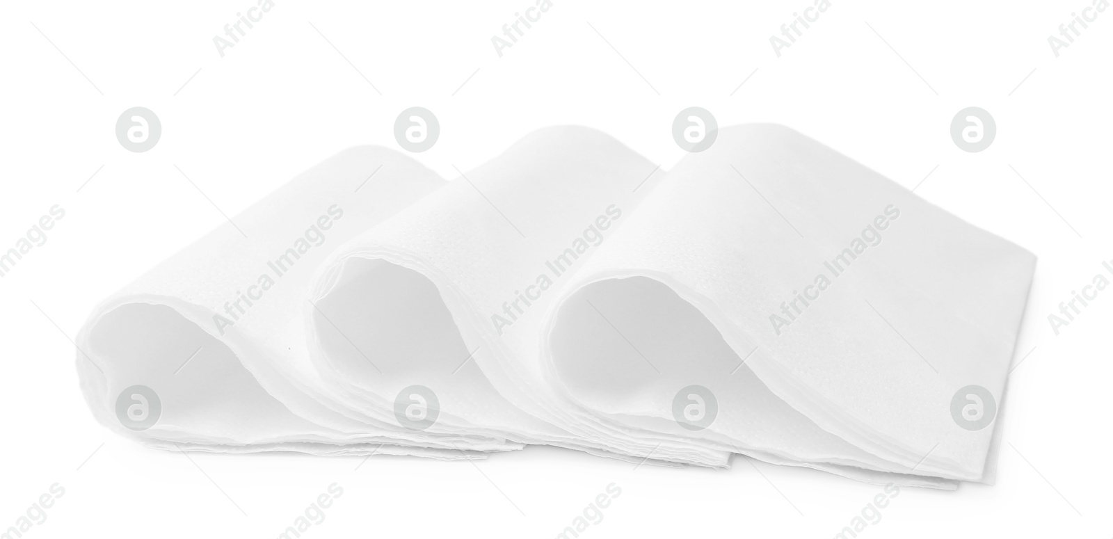 Folded disposable paper handkerchiefs isolated on white Photo of Folded disposable paper handkerchiefs isolated on white