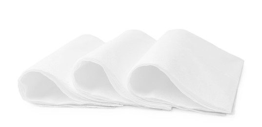 Photo of Folded disposable paper handkerchiefs isolated on white