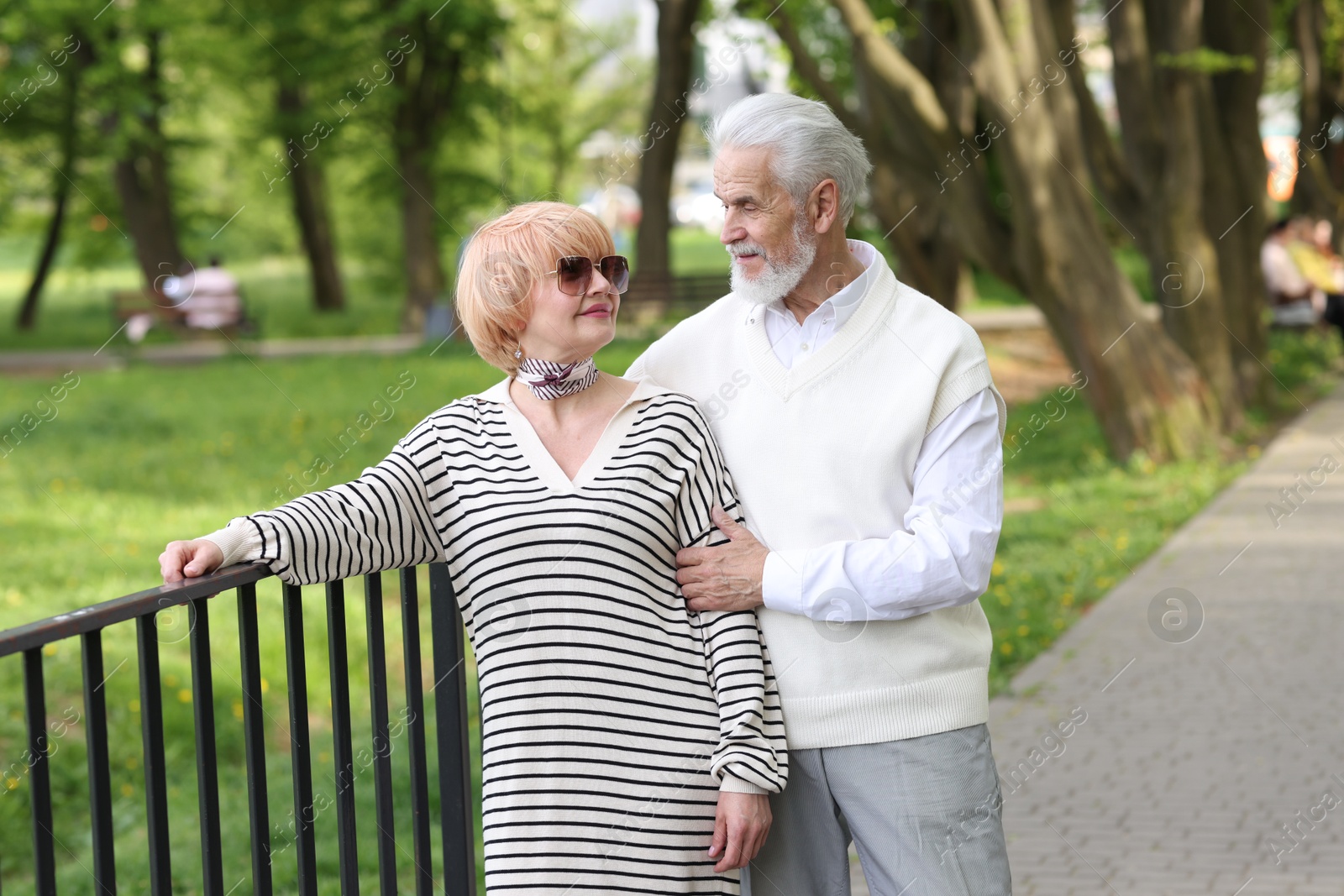 Lovely senior couple spending time together in park Photo of Lovely senior couple spending time together in park