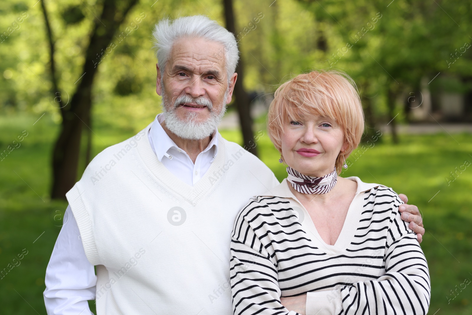 Lovely senior couple spending time together in park Photo of Lovely senior couple spending time together in park