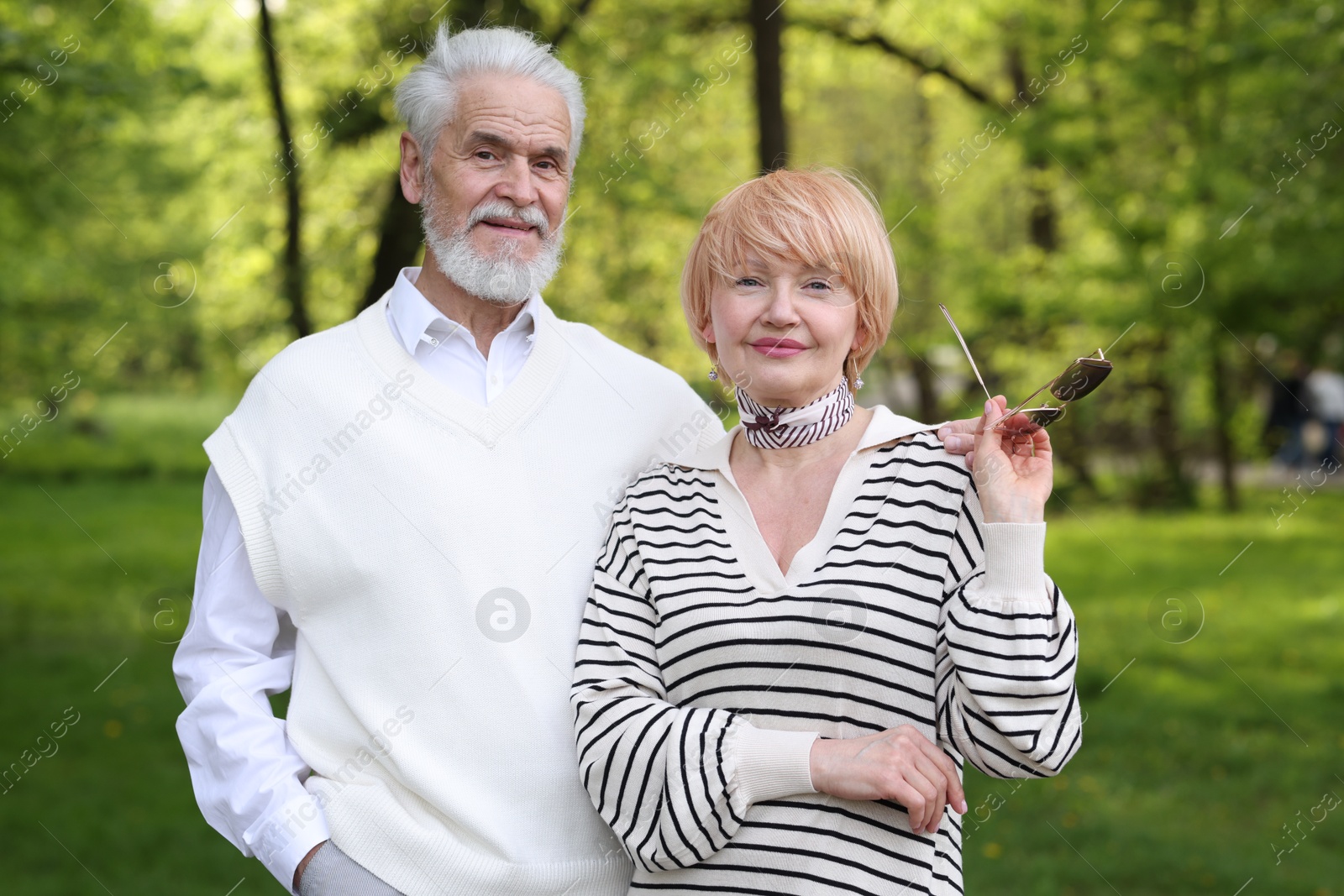 Lovely senior couple spending time together in park Photo of Lovely senior couple spending time together in park