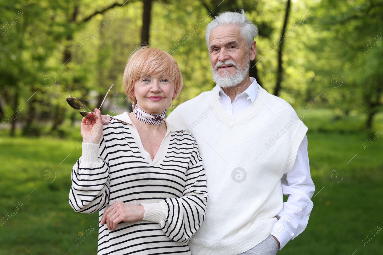 Lovely senior couple spending time together in park Photo of Lovely senior couple spending time together in park