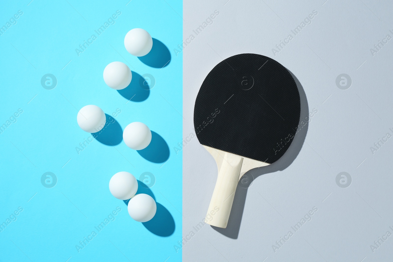 Ping pong racket and balls on color background, flat lay Photo of Ping pong racket and balls on color background, flat lay