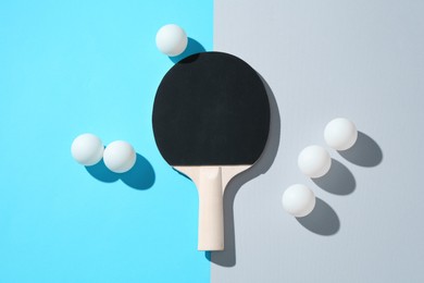 Photo of Ping pong racket and balls on color background, flat lay