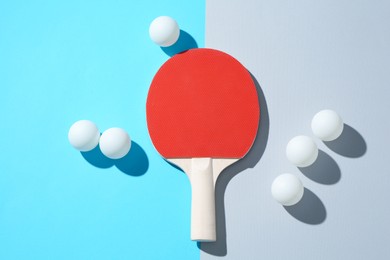 Photo of Ping pong racket and balls on color background, flat lay