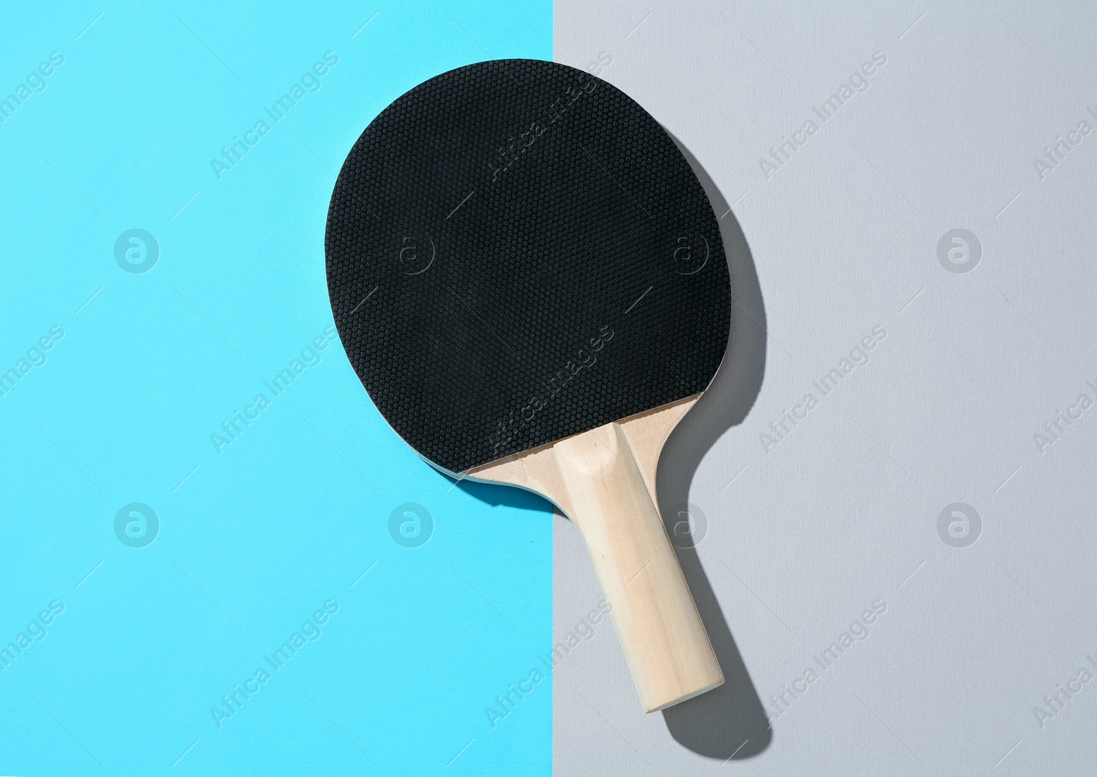 One ping pong racket on color background, top view Photo of One ping pong racket on color background, top view