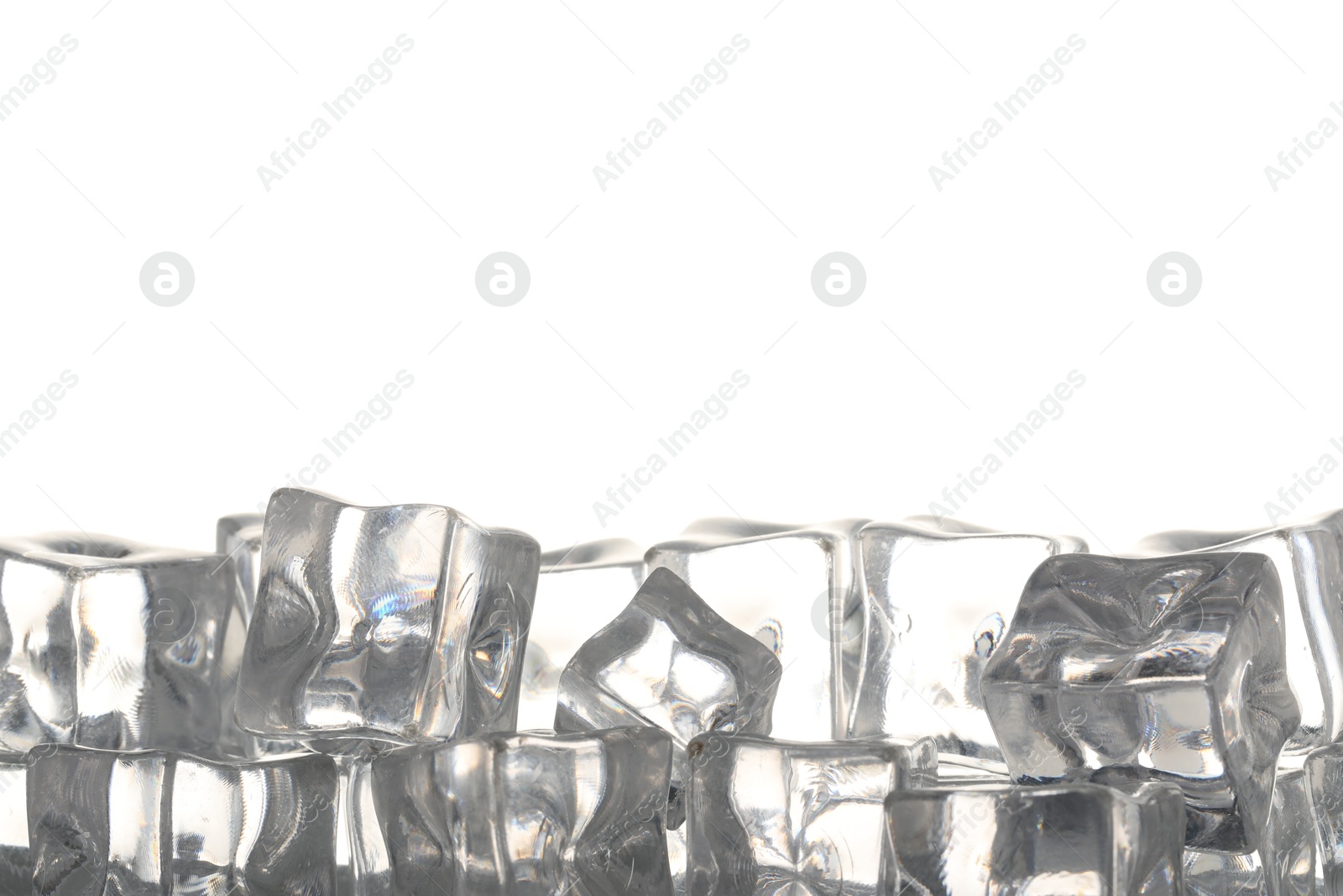 Many ice cubes on light background, closeup. Space for text Photo of Many ice cubes on light background, closeup. Space for text