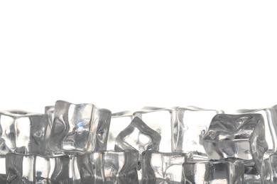 Photo of Many ice cubes on light background, closeup. Space for text