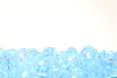 Photo of Cubes of clear ice on white background