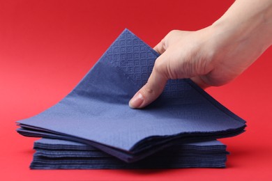 Photo of Woman with handkerchiefs on red background, closeup