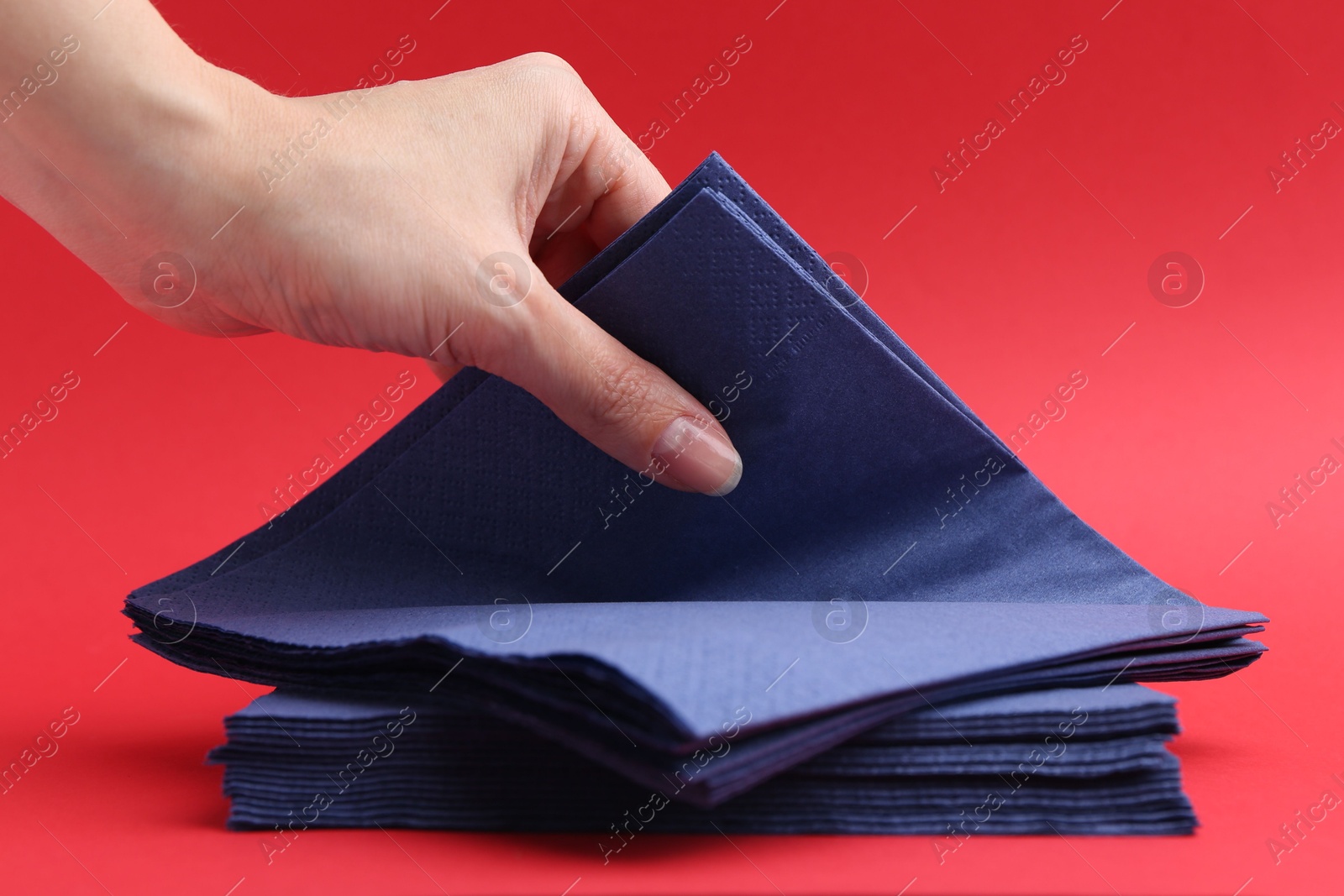 Woman with handkerchiefs on red background, closeup Photo of Woman with handkerchiefs on red background, closeup