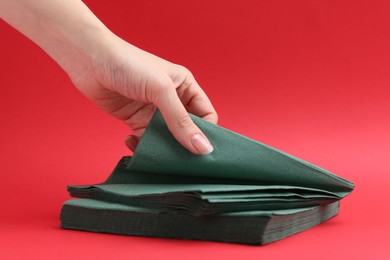 Photo of Woman with handkerchiefs on red background, closeup