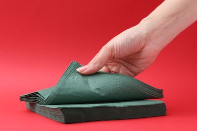 Photo of Woman with handkerchiefs on red background, closeup