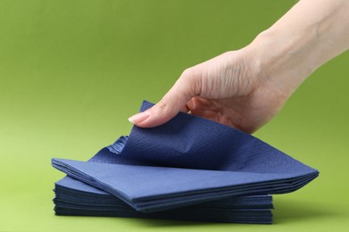 Photo of Woman with handkerchiefs on green background, closeup