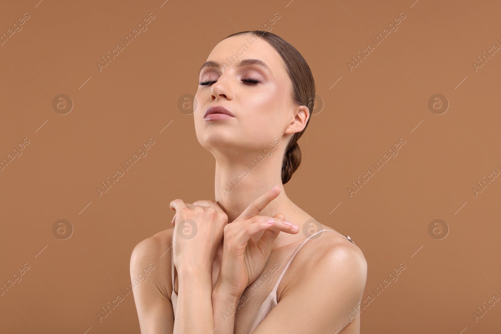 Portrait of beautiful young woman on beige background Photo of Portrait of beautiful young woman on beige background