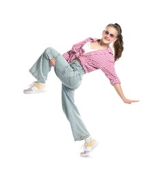 Photo of Girl in stylish clothes and sunglasses dancing on white background