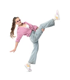 Photo of Girl in stylish clothes and sunglasses dancing on white background