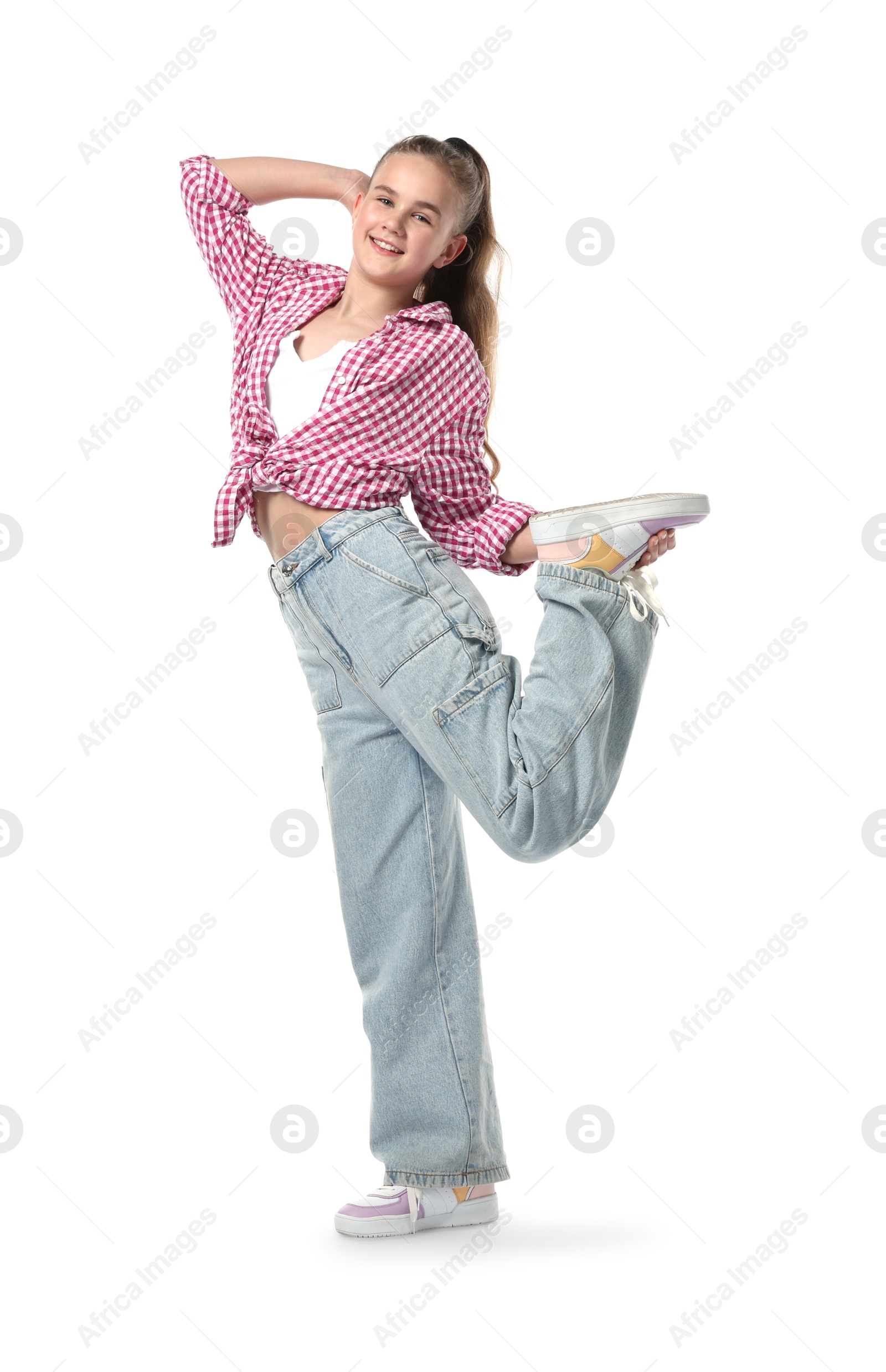 Girl in stylish clothes dancing on white background Photo of Girl in stylish clothes dancing on white background