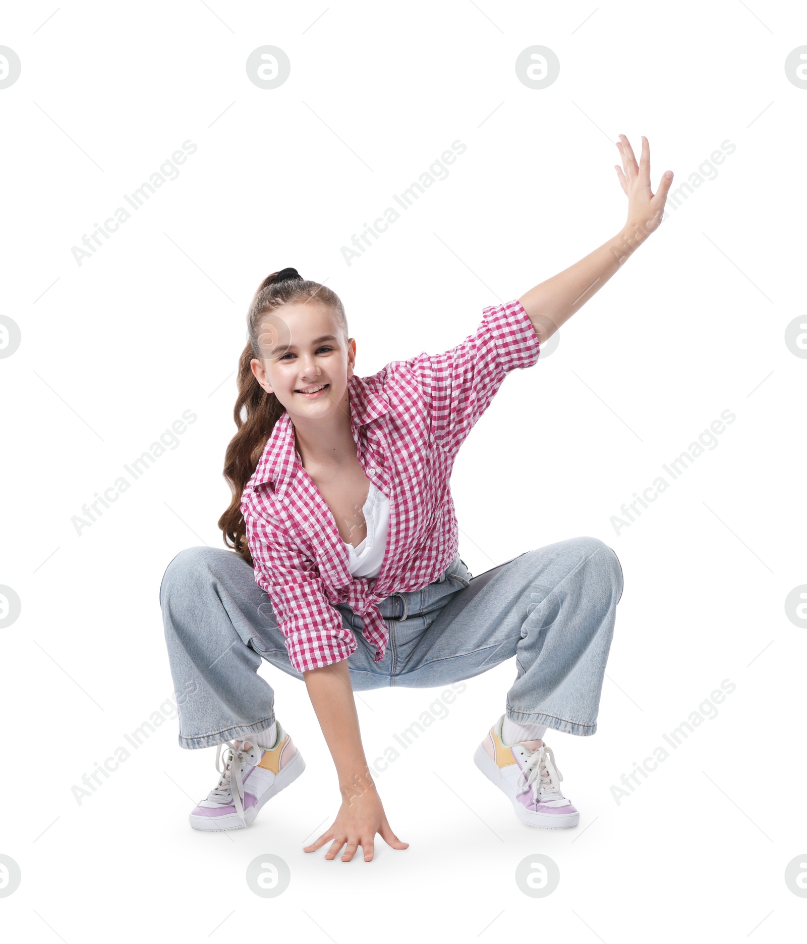 Girl in stylish clothes dancing on white background Photo of Girl in stylish clothes dancing on white background