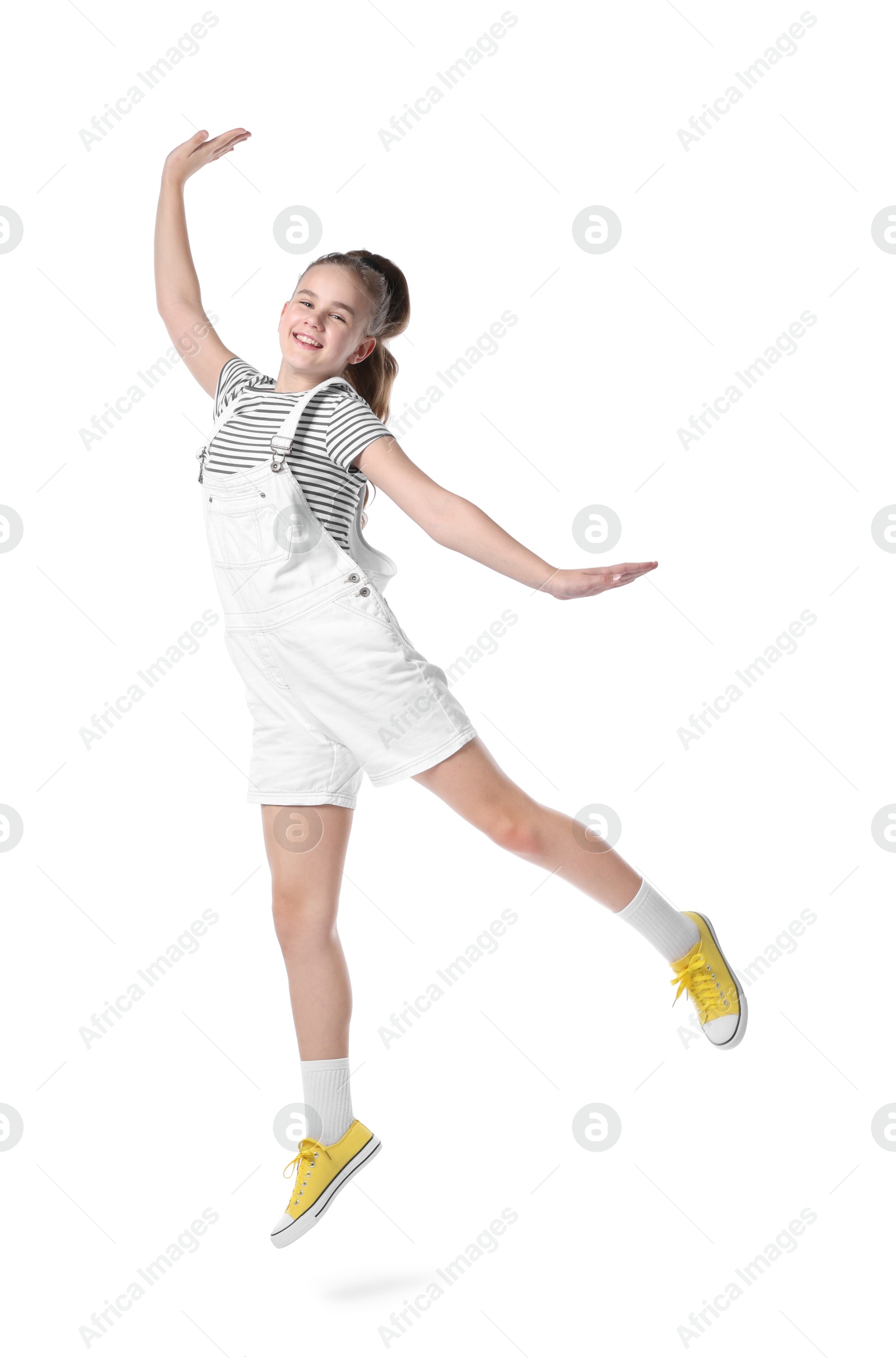 Girl in stylish clothes jumping and dancing on white background Photo of Girl in stylish clothes jumping and dancing on white background
