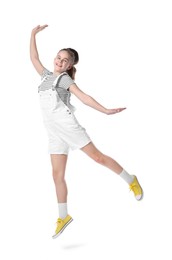 Photo of Girl in stylish clothes jumping and dancing on white background