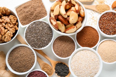 Photo of Different superfoods on white background, flat lay