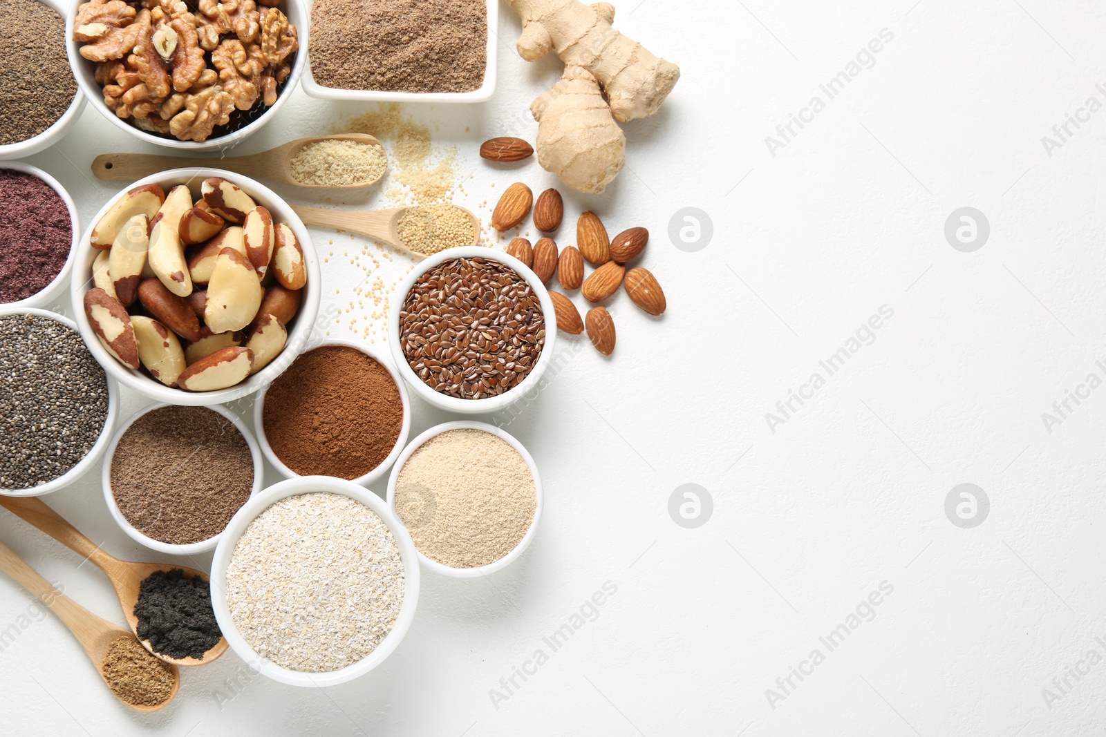 Different superfoods on white background, flat lay. Space for text Photo of Different superfoods on white background, flat lay. Space for text