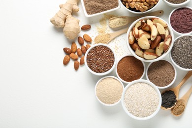 Photo of Different superfoods on white background, flat lay. Space for text