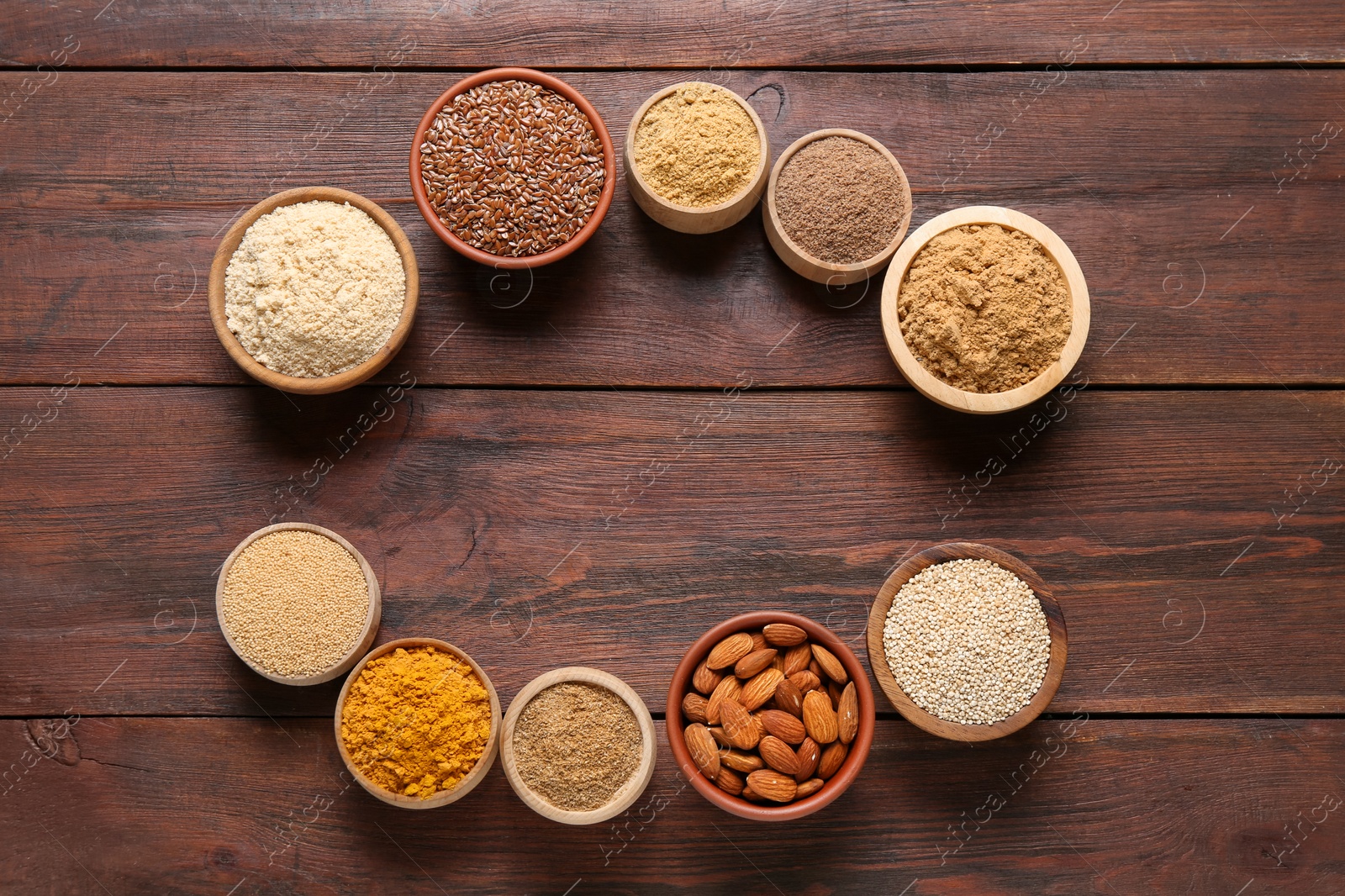 Frame of different superfood products on wooden table, flat lay. Space for text Photo of Frame of different superfood products on wooden table, flat lay. Space for text